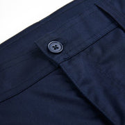 A lightweight navy cargo short from Apache. The waist on the Banff short is elasticated at the hips to ensure comfort for the wearer. The short includes, two inset rear pockets, two traditional front pockets, a ruler pocket, a mobile phone pocket and a side cargo pocket to the right leg. Triple stitched in key areas to increase durability. Good quality YKK zip fly. A perfect short for warehouse/driving and many more industrial applications.  